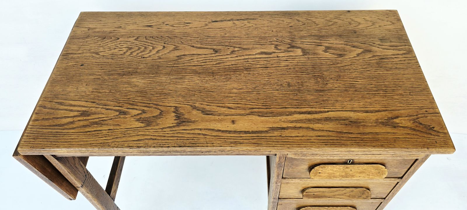 photo furniture A Petite Mid Century Oak Drop Leaf Desk, Single Pedestal.