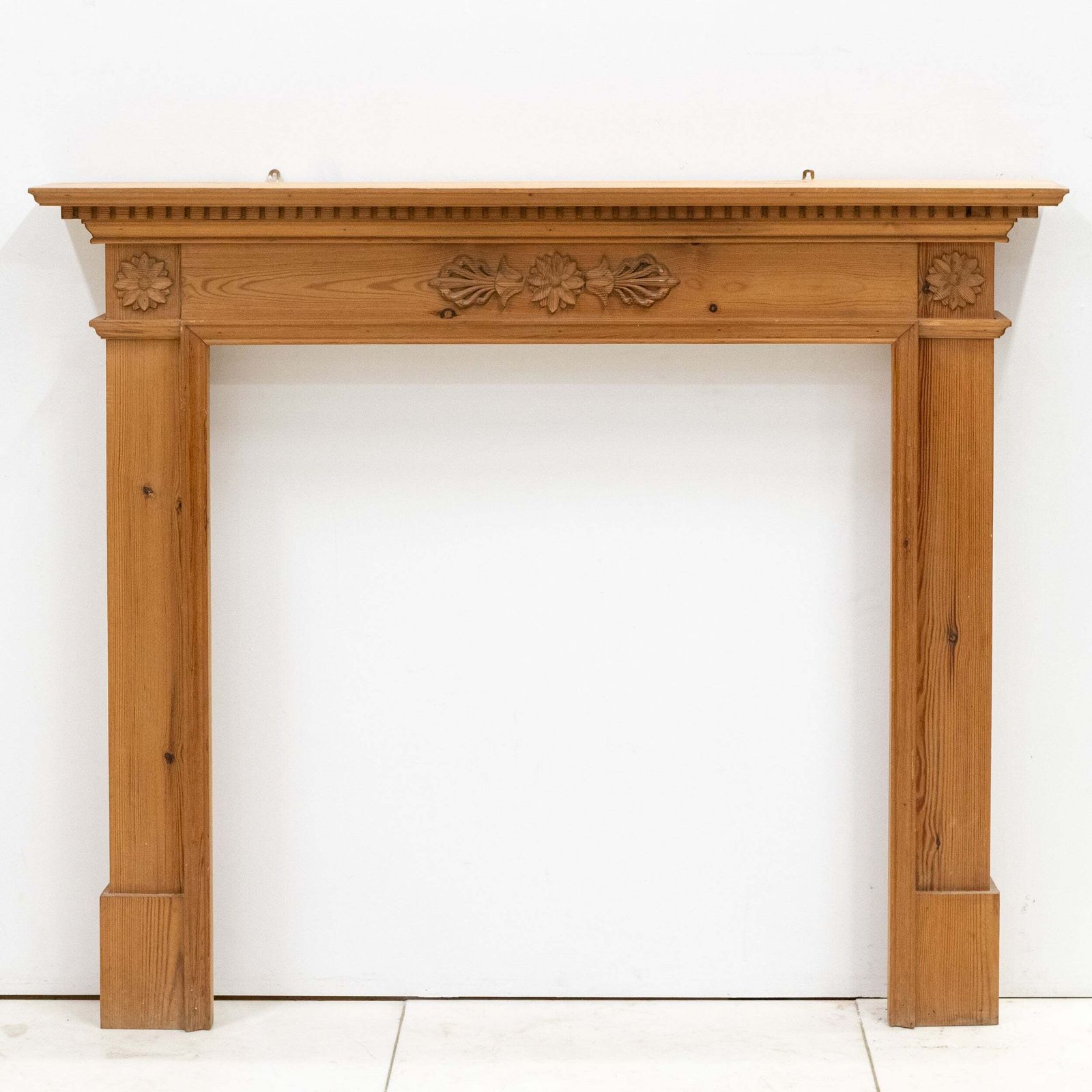 Antique Wooden Fireplace Surround With Flowers photo for sale