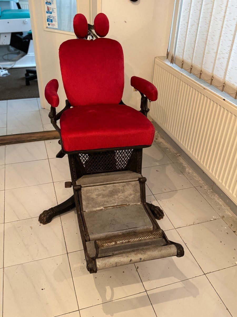 Barber Chair With Red Upholstery And Adjustable Footrest
