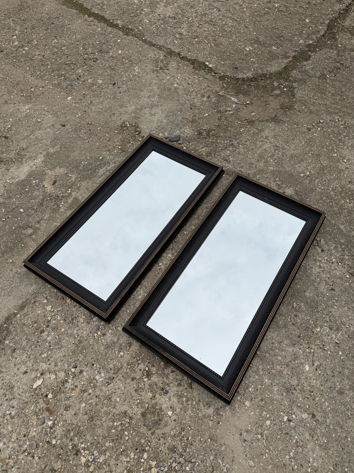 photo furniture Pair Of Black And Gold Mirrors Minimal Sophisticated Wall Mirrors