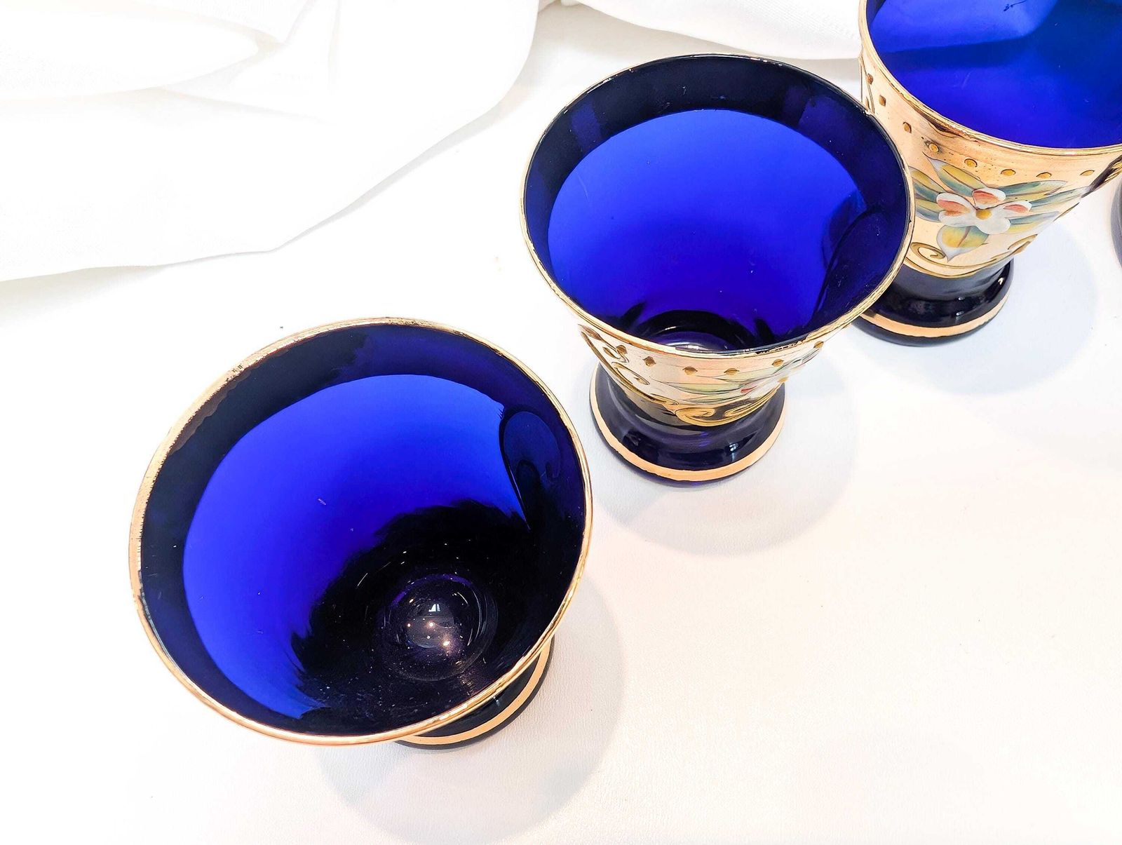 photo furniture Murano Mid Century Cobalt Blue Glass Decanter And Six Liqueur/Shot Glasses. All Pieces Feature 24 Karat Gold Decoration And Hand Painted.