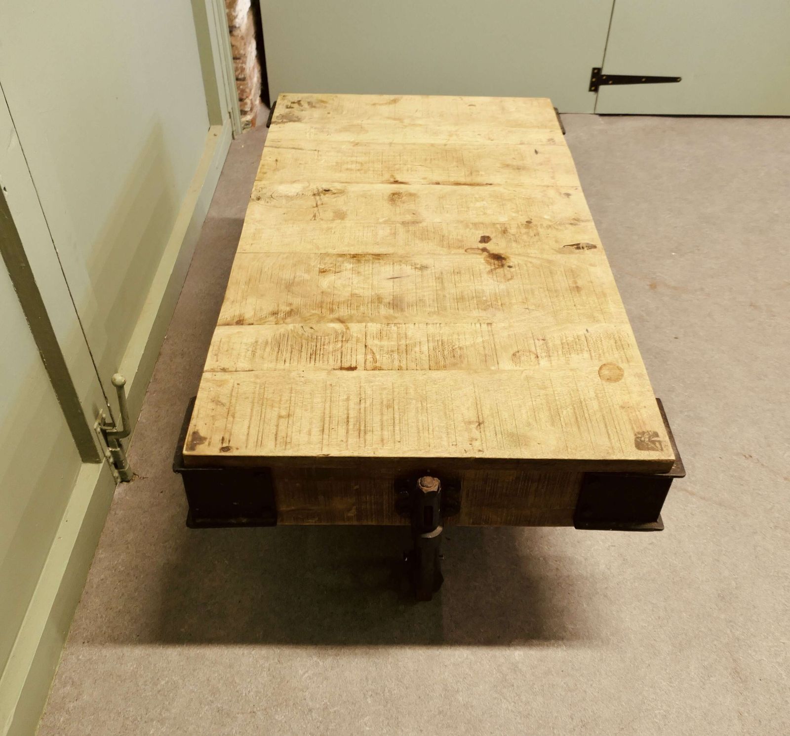 A Unique Wood Framed Industrial Coffee Table The Table Has A Thick Wooden Top photo for sale
