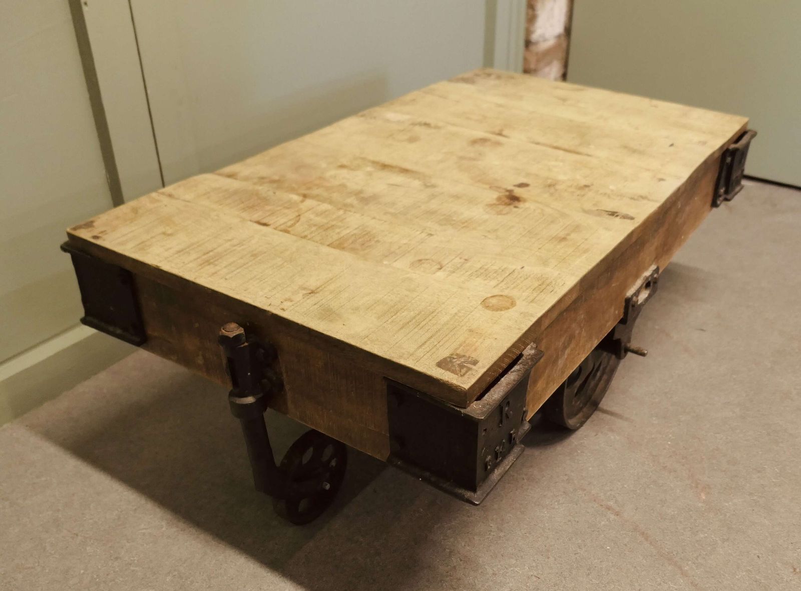 A Unique Wood Framed Industrial Coffee Table The Table Has A Thick Wooden Top photo Furniture