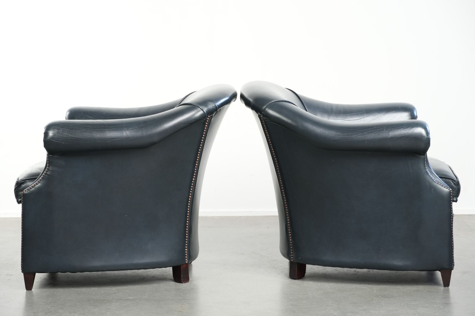 Beautiful And Comfortable Set Of Dark Blue Cowhide Club Armchairs With A Unique And Timeless Design photo Furniture