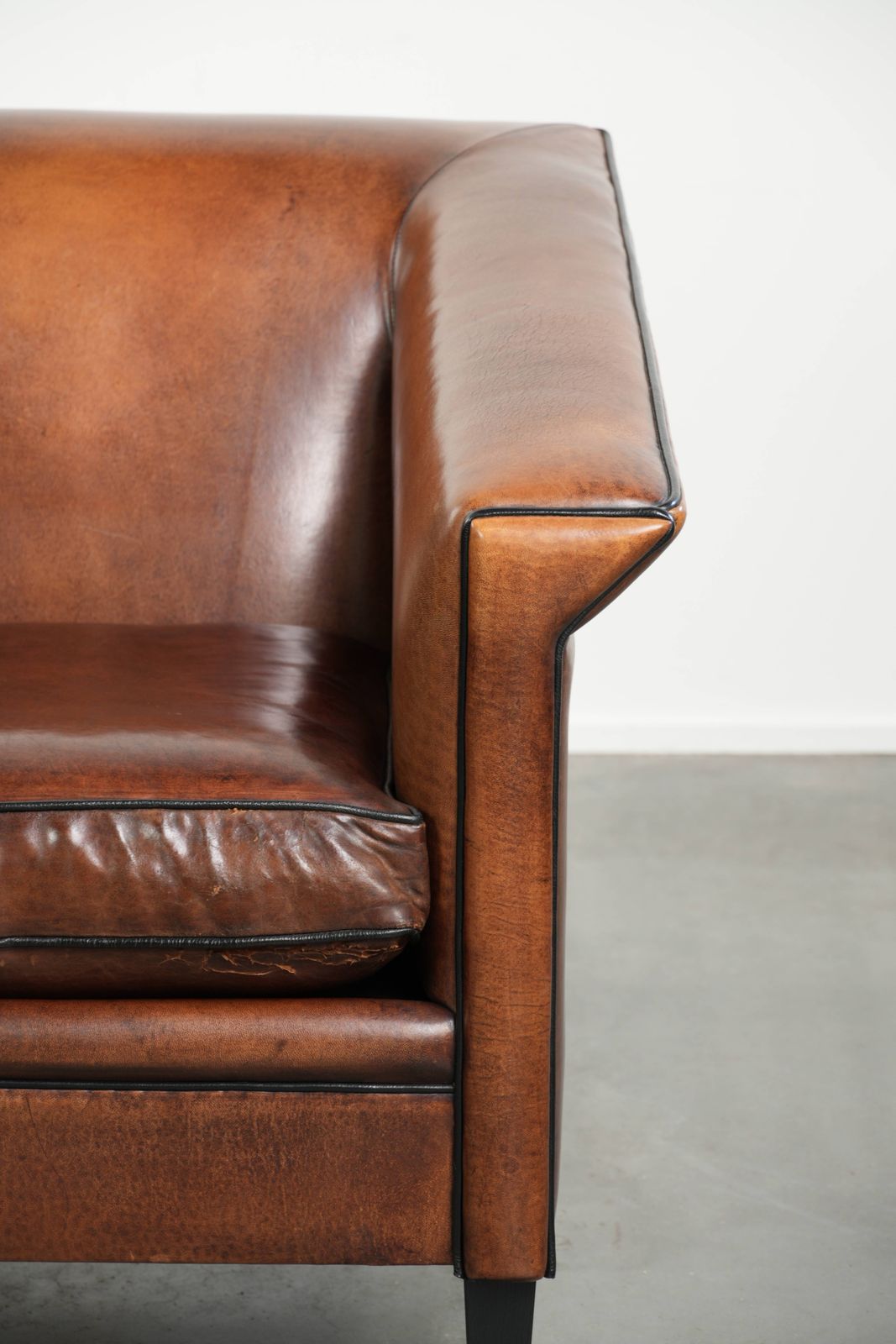 photo furniture Beautiful, Sleek Art Deco Design Armchair/Lounge Chair In Sheepskin With Black Piping And A Gorgeous Warm Color.
