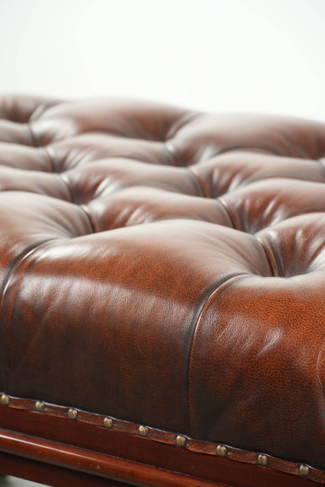 Furniture Large Brown Cowhide Chesterfield Ottoman In English Style With Elegant Legs And Brass Casters photo