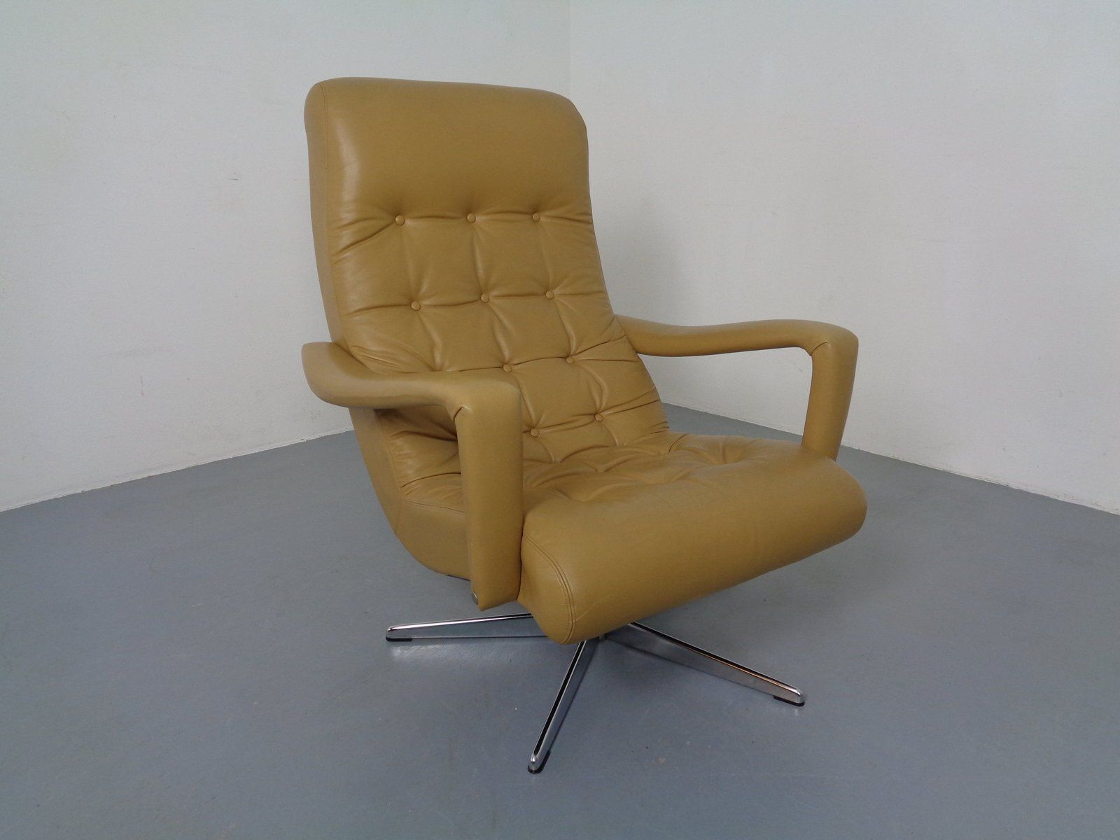 photo for sale Set Of Leather Swivel Easy Chair And Ottoman, Switzerland, 1960s