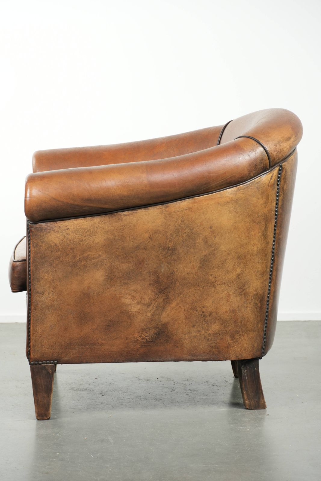 Characterful And Comfortable Sheepskin Club Armchair With A Beautiful Patina And A Refined Finish With Black Piping. photo 895.0