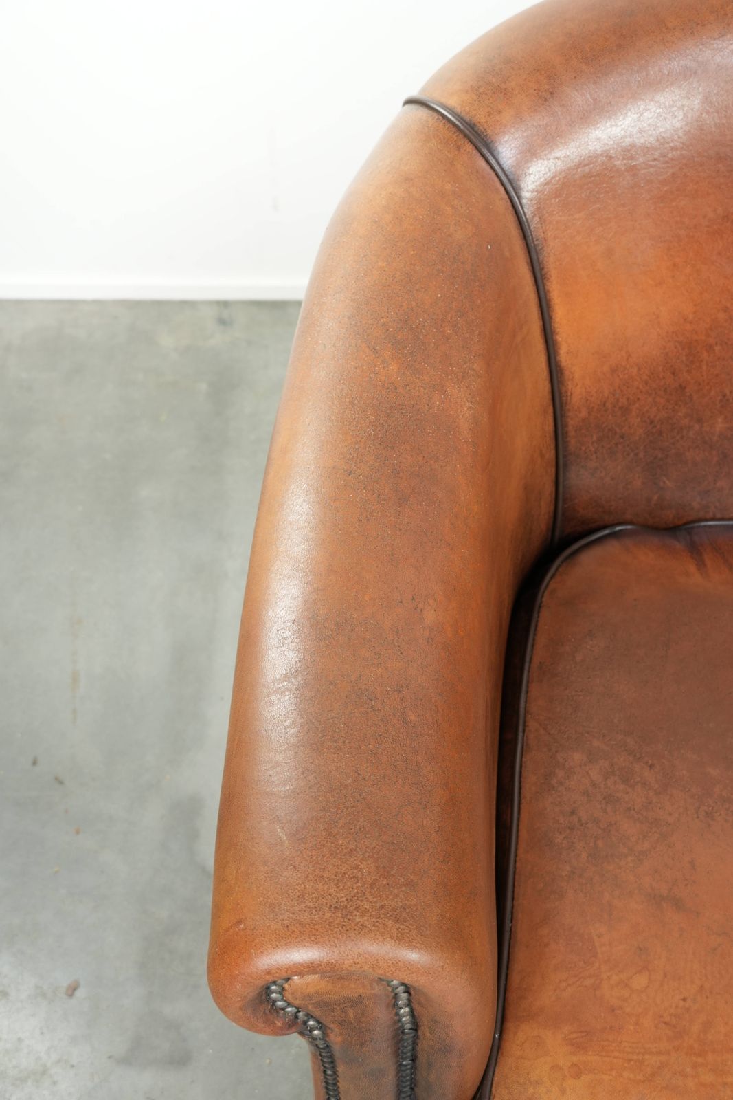 Characterful And Comfortable Sheepskin Club Armchair With A Beautiful Patina And A Refined Finish With Black Piping. photo buy