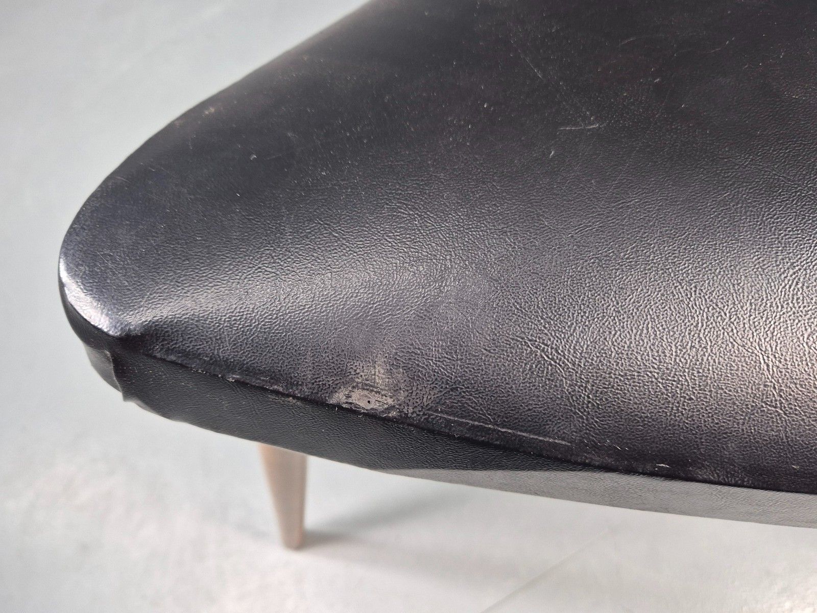 photo vintage Vintage Danish Mid Century Footstool Triangular Black Vinyl 1960s Retro Eb12152