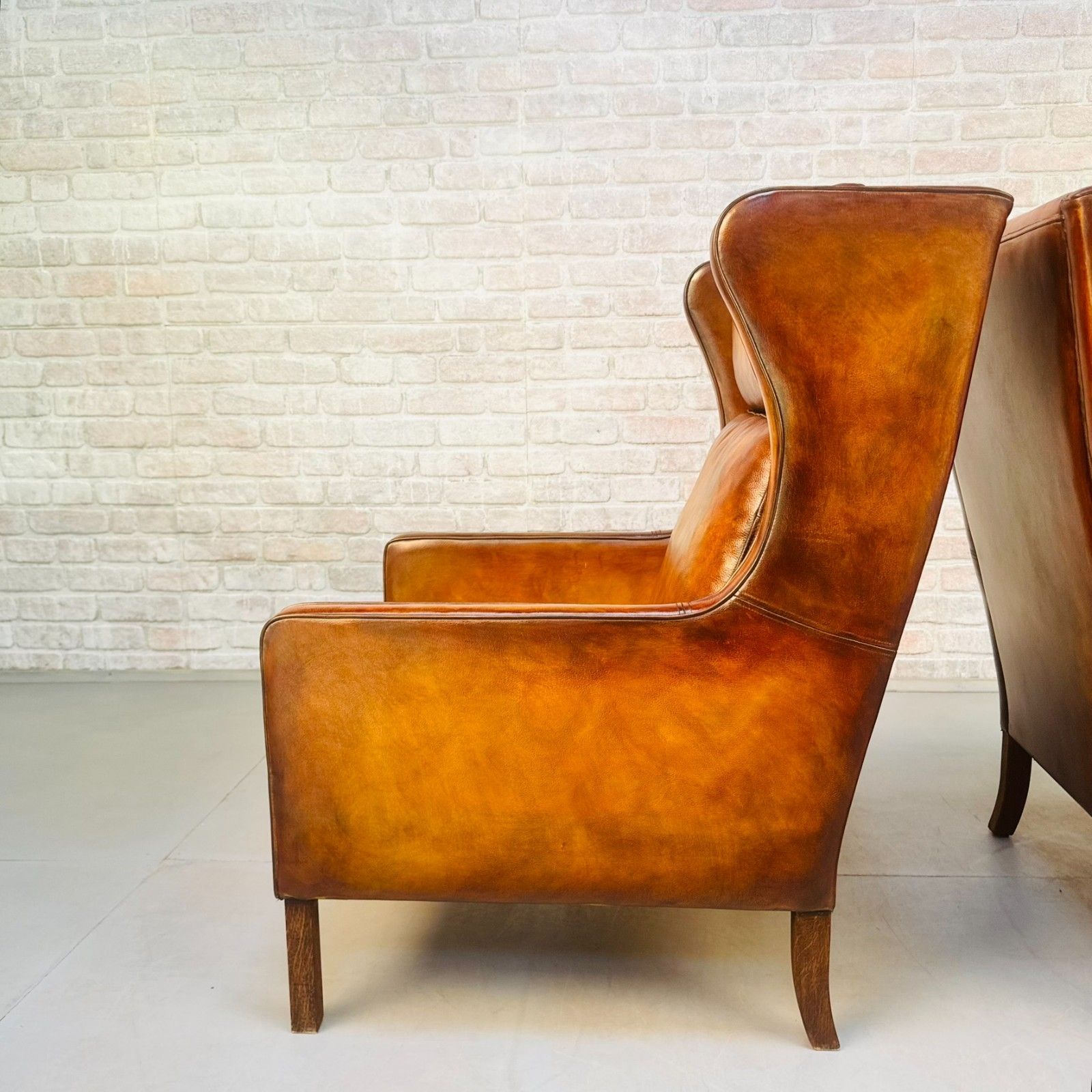 photo for sale Pair Vintage Danish Wingback Chairs & Footstool Tan Leather Lounge Set