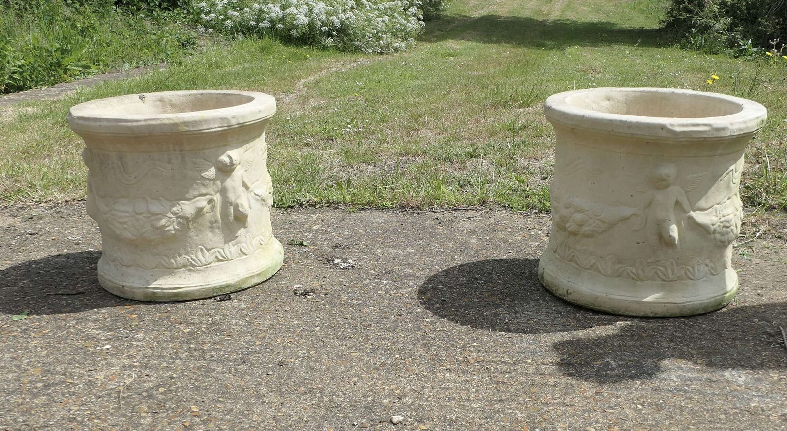A Pair Of Round Garden Planters With Winged Cherubs This Is A Good Large Pair photo 900.0