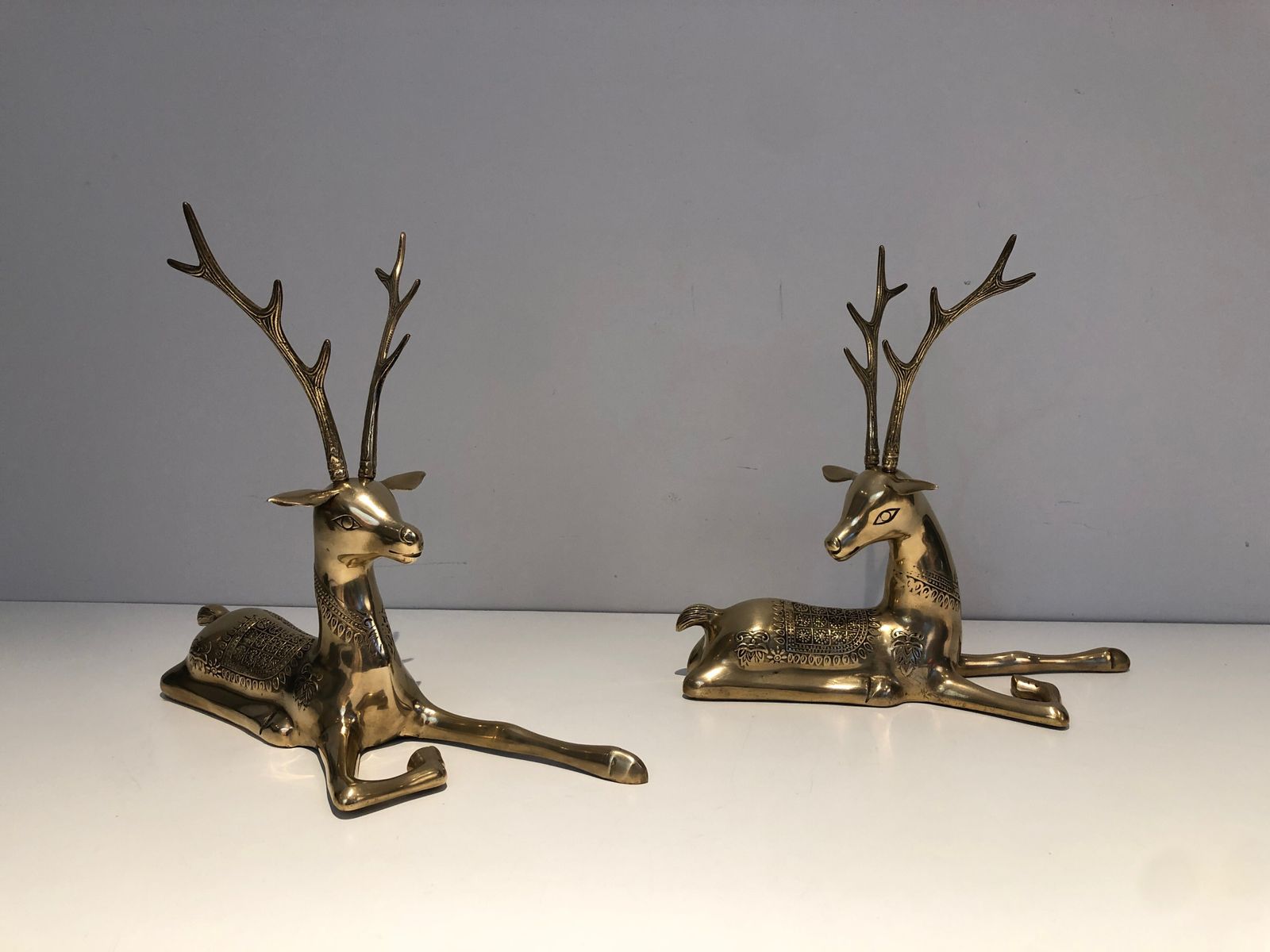 Pair Of Bronze Reclining Deer Engraved With Shamanic Motifs. French Work. Circa 1970