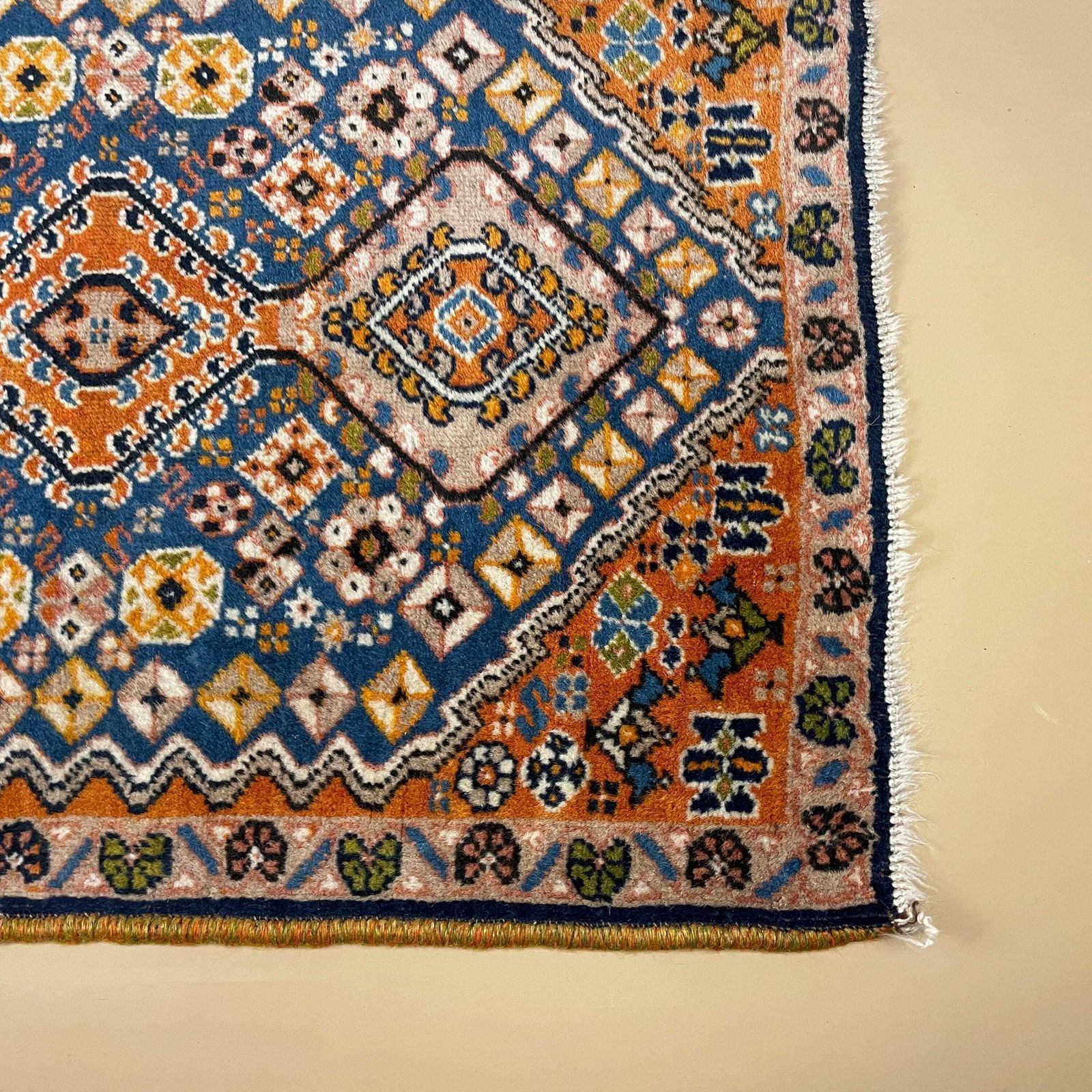 Small Accent Rug Wool Middle Eastern Style Decorative Tasselled Orange Blue Detailed Pattern photo Textiles