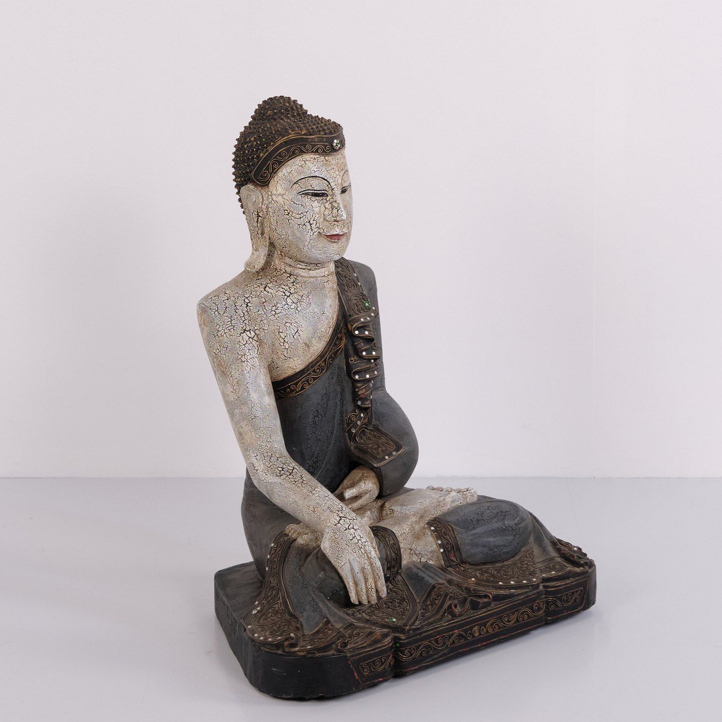 Buddha Figure In Carved Wood With Light And Blue Toned Patina From Thailand, 1920s photo furniture