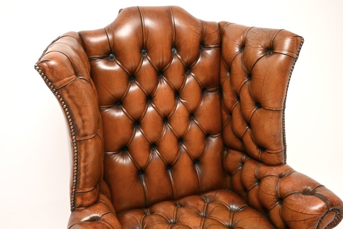 Antique Deep Buttoned Leather Wing Back Armchair photo vinterior