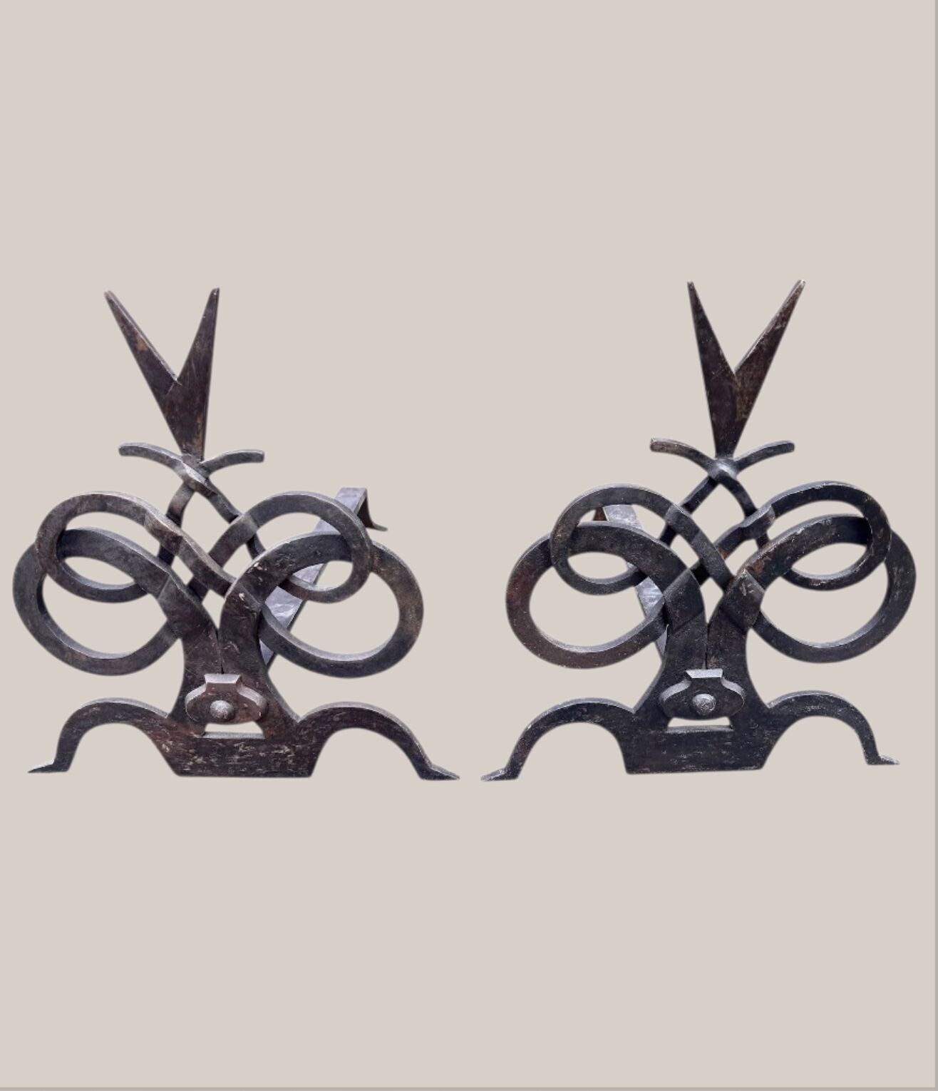 A Pair Of French Hand Forged Wrought Iron Fire Dogs In The Style Of Gilbert Poillerat photo for sale