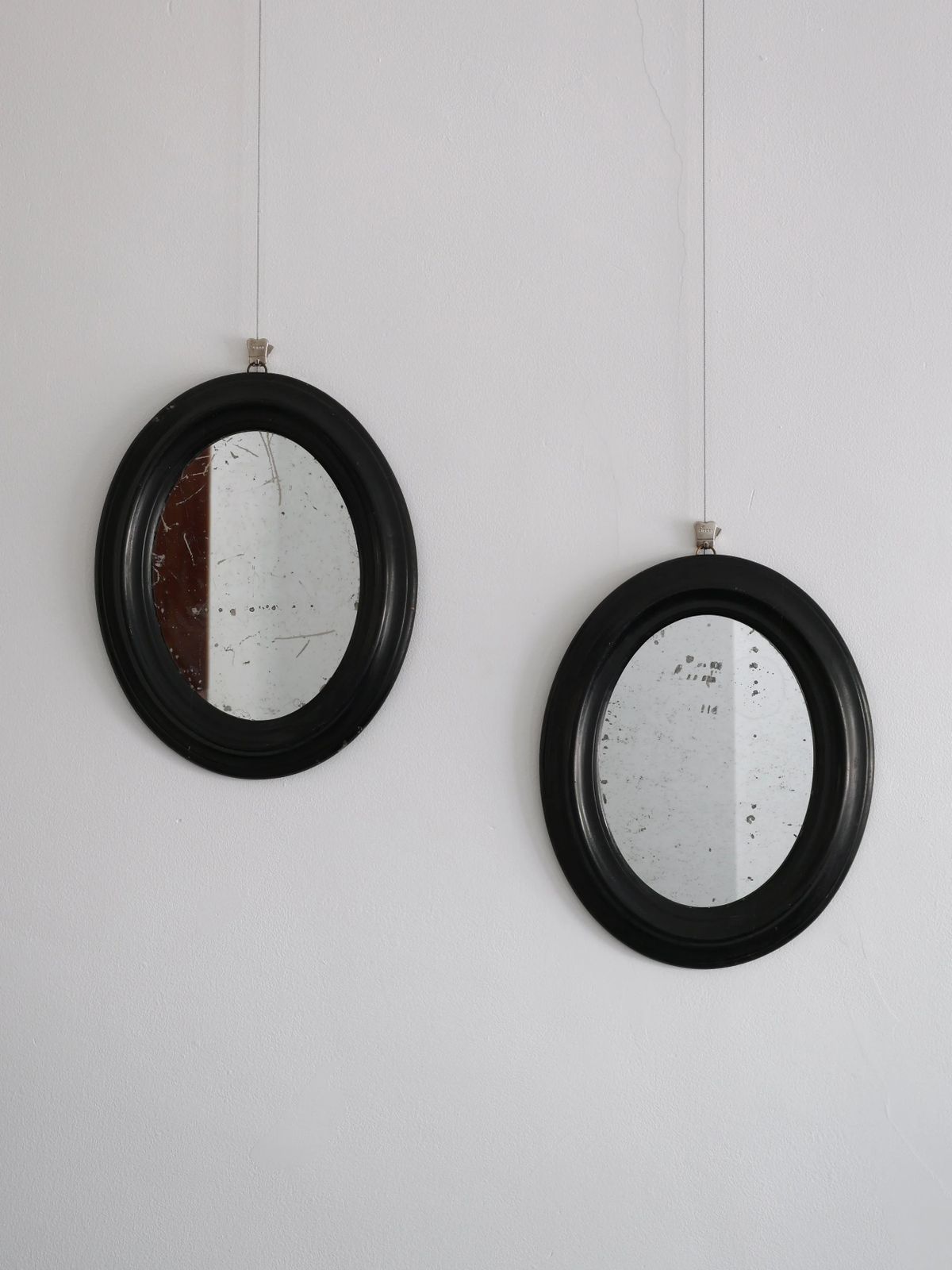 Pair Of Ebonised Oval Mirrors, 1800s