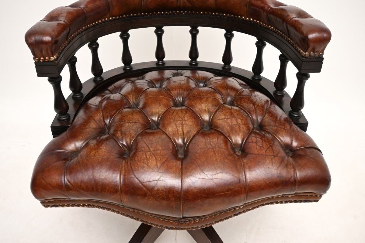photo furniture Antique Leather And Mahogany Swivel Captains Desk Chair