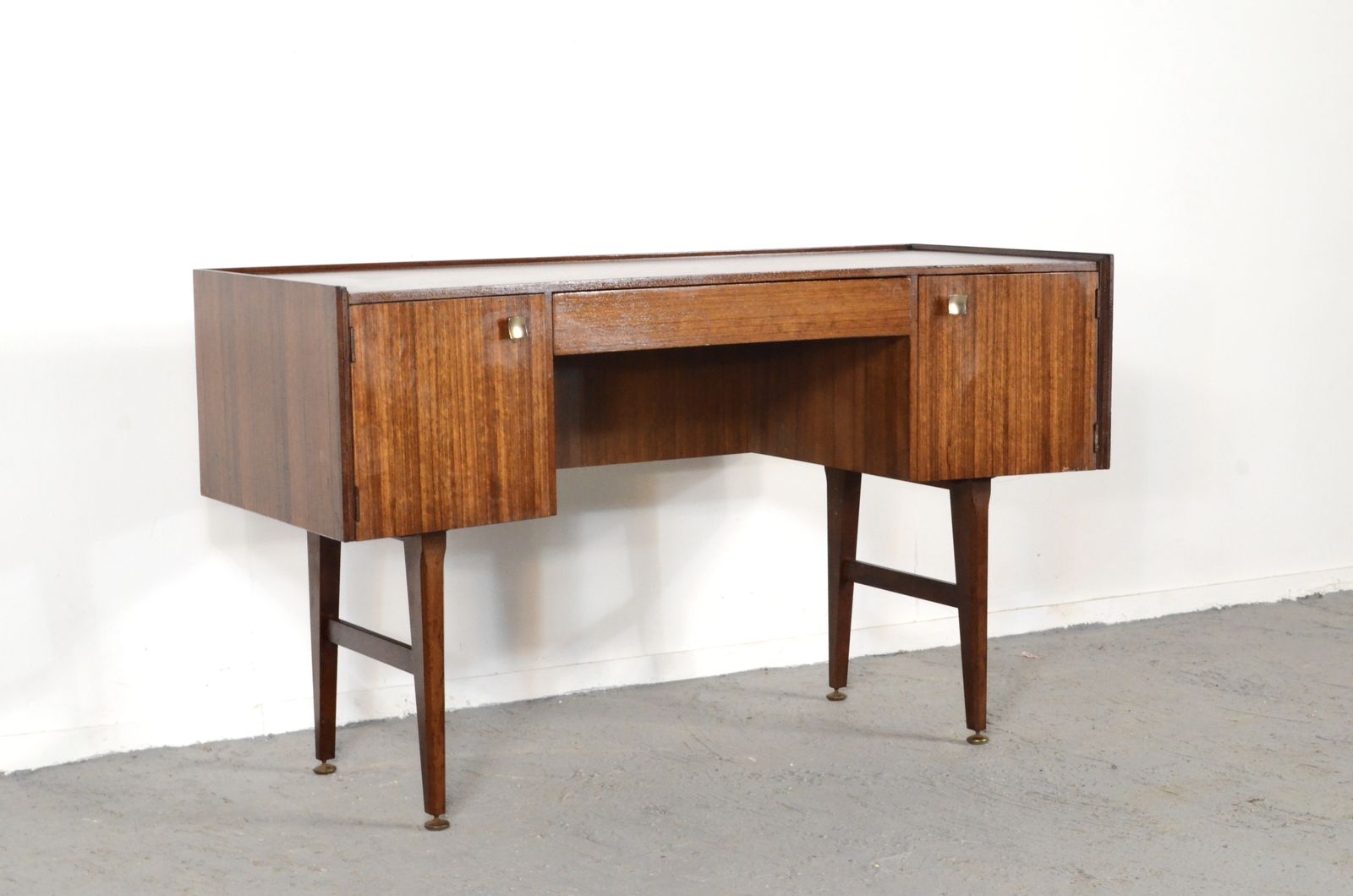photo furniture Midcentury Meredew Desk In Walnut And Brass.