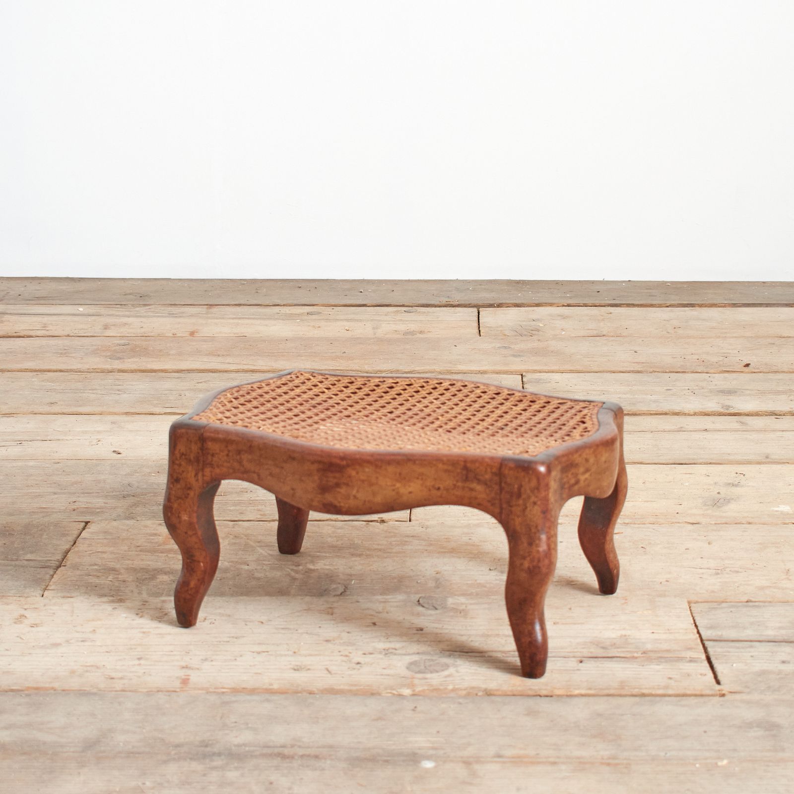 Small Antique French Cane Foot Stool. photo furniture