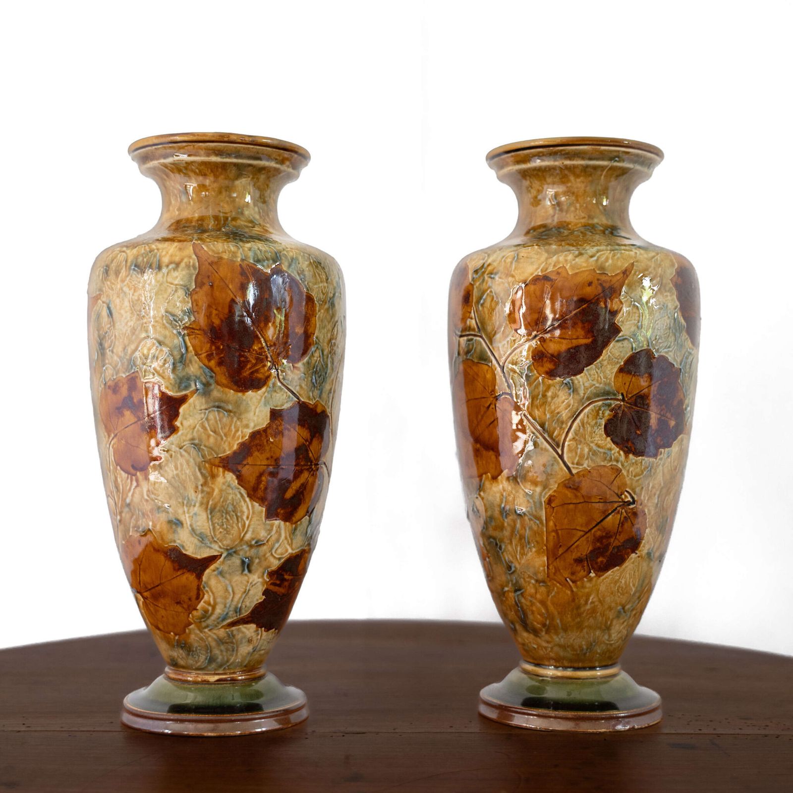 Pair Of Royal Doulton Lambeth 'Autumn Foliage' Vases.
