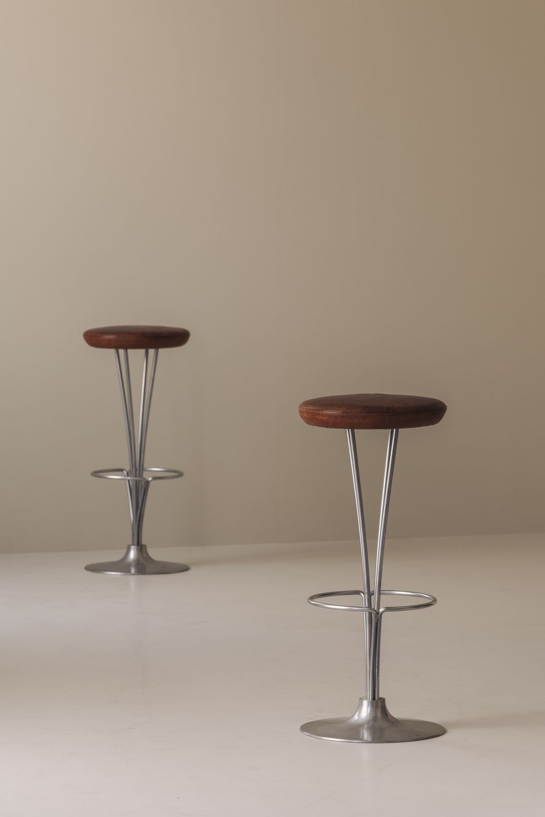 photo for sale Set Of Two Bar Stools Patinated Leather By Piet Hein For Fritz Hansen, Dk 1960s.