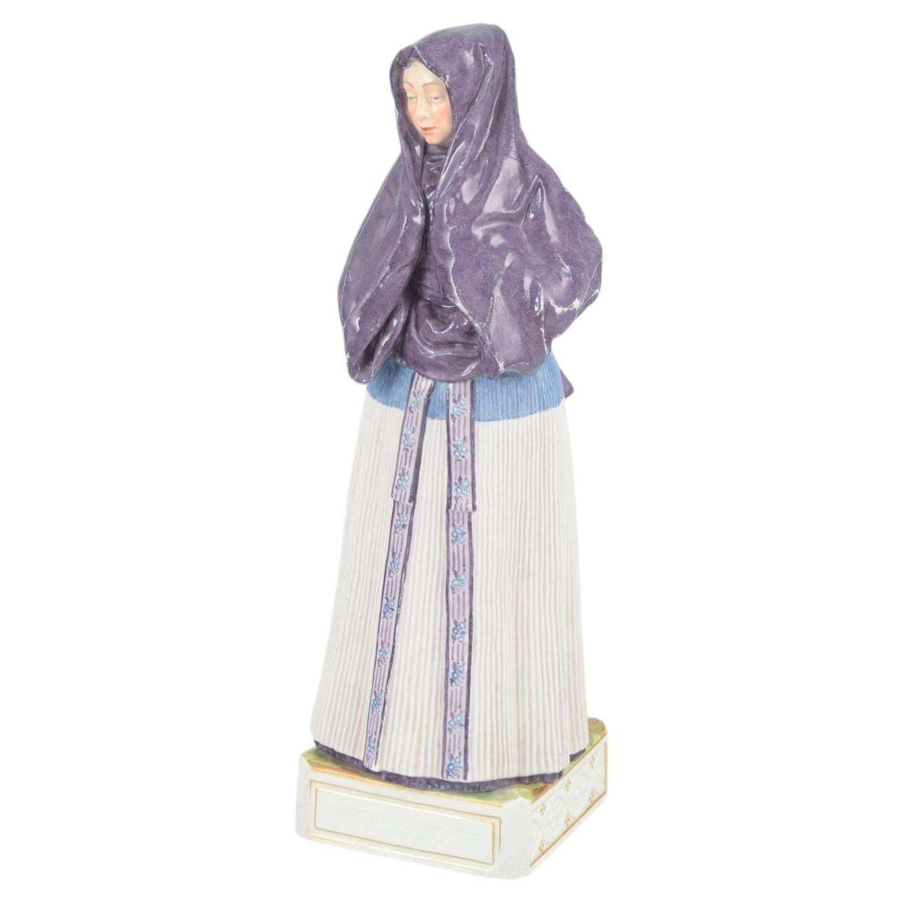 Royal Copenhagen. Porcelain Figurine Of Woman In Traditional Folk Costume.