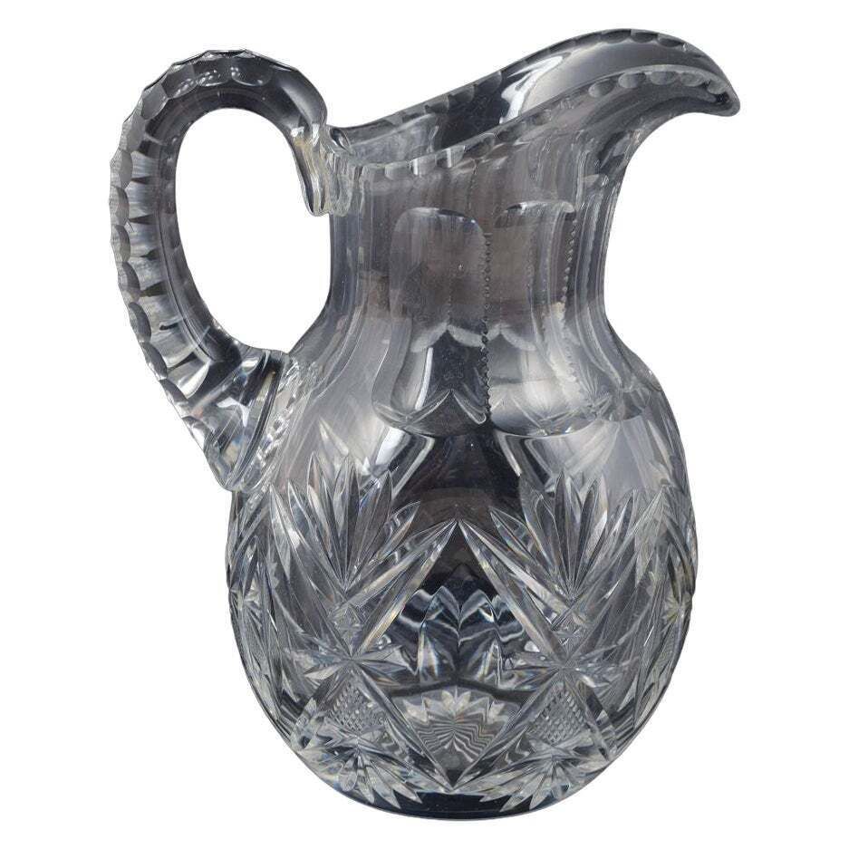 Pichet en cristal transparent à motifs taillés d'étoiles et de feuilles, années 1930/40