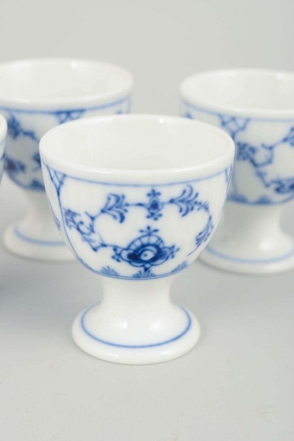 Royal Copenhagen. Ensemble de quatre coquetiers, Blue Fluted Plain. Années 1920. photo for sale