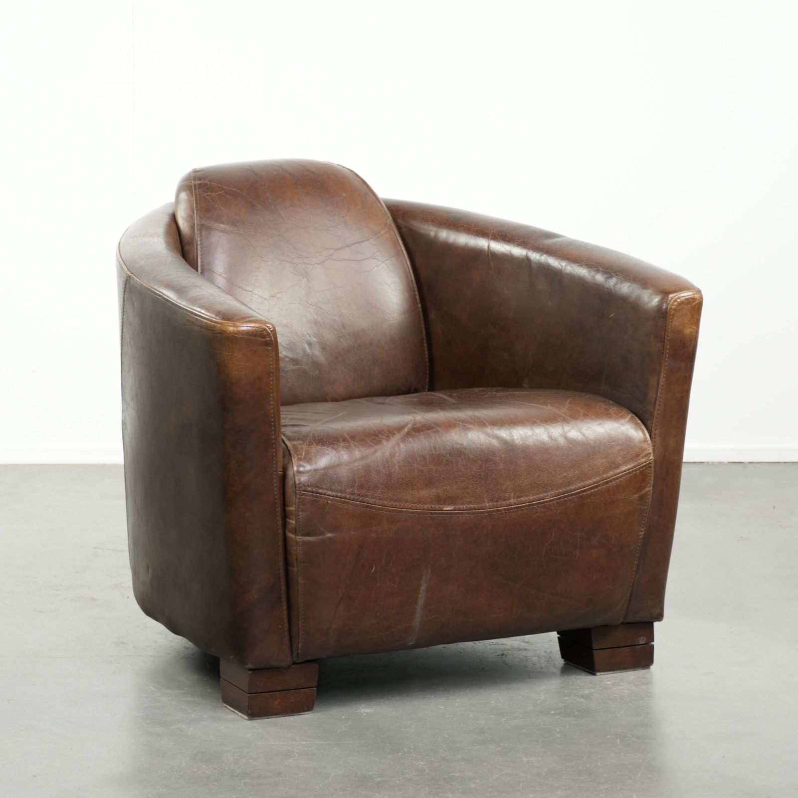Characterful And Robust Dark Cognac Brown Cowhide Leather Aviator Design Armchair With An Interesting Shape