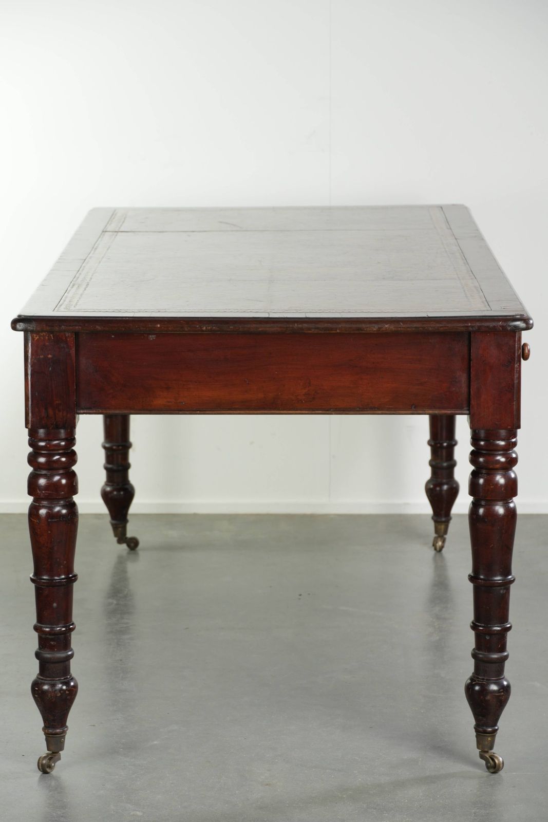 Antique English Writing Desk From The Late 19th Century With A Warm Wood Color And A Dark Brown Leather Top With Gold Accents. photo Furniture