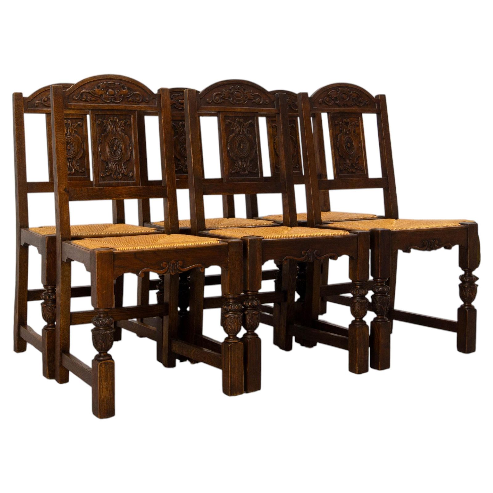 Zes Spaanse eiken eetkamerstoelen met rieten zitting, ca. 1950