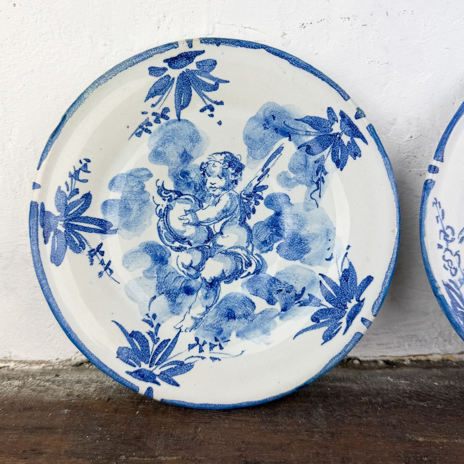 photo furniture Pair Of Antique Albisola Hand Painted Ceramic Plates By Giuseppe Mazzotti, White And Blue Maiolica Cherub Plates