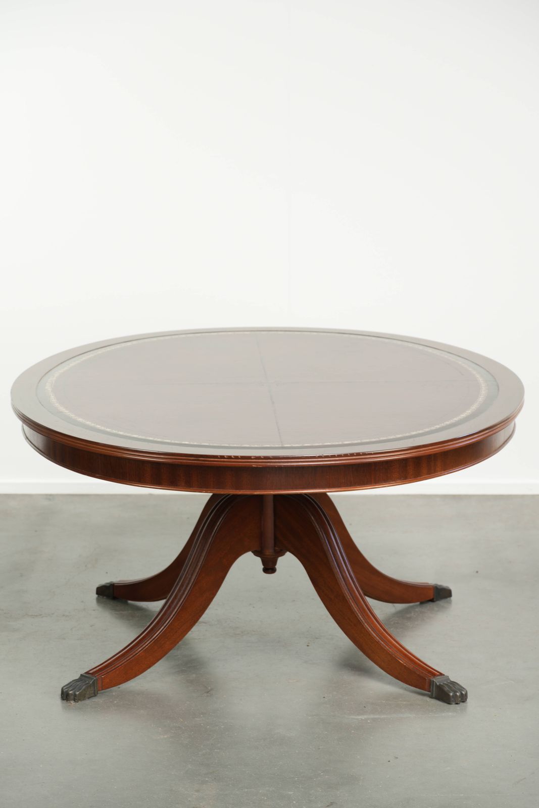 Elegant Oval Coffee Table With A Red Leather Top In English Style With Beautiful Details From The 20th Century photo for sale
