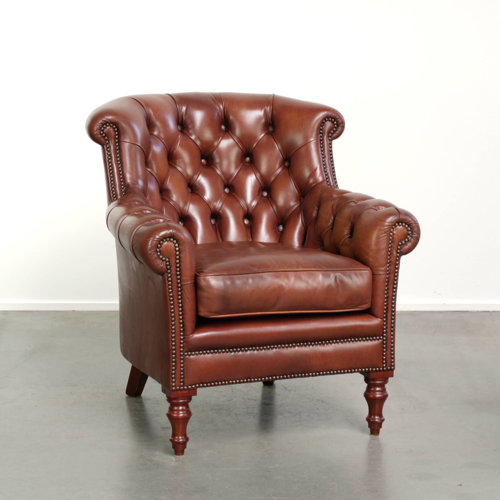 Very High Quality Cognac Colored Cowhide Chesterfield Armchair In English Style With A Timeless Design
