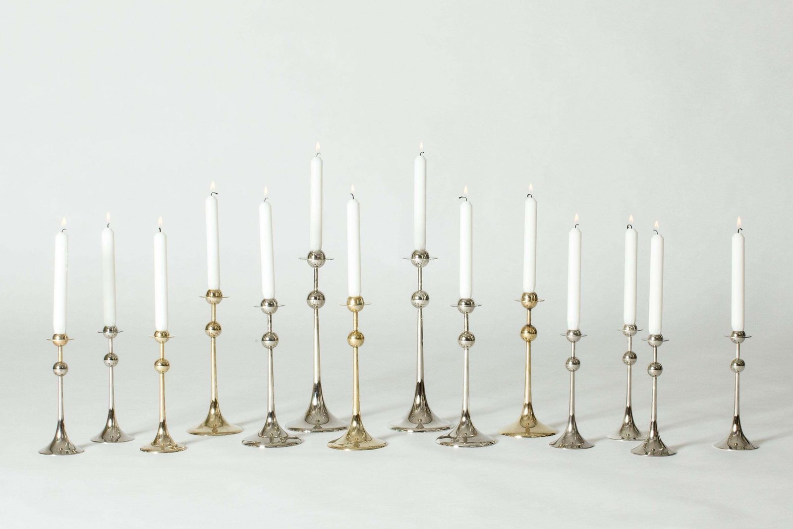 Midcentury Set Of 14 Silver Plated Candlesticks By Kjell Engman, Sweden, 1979 photo furniture