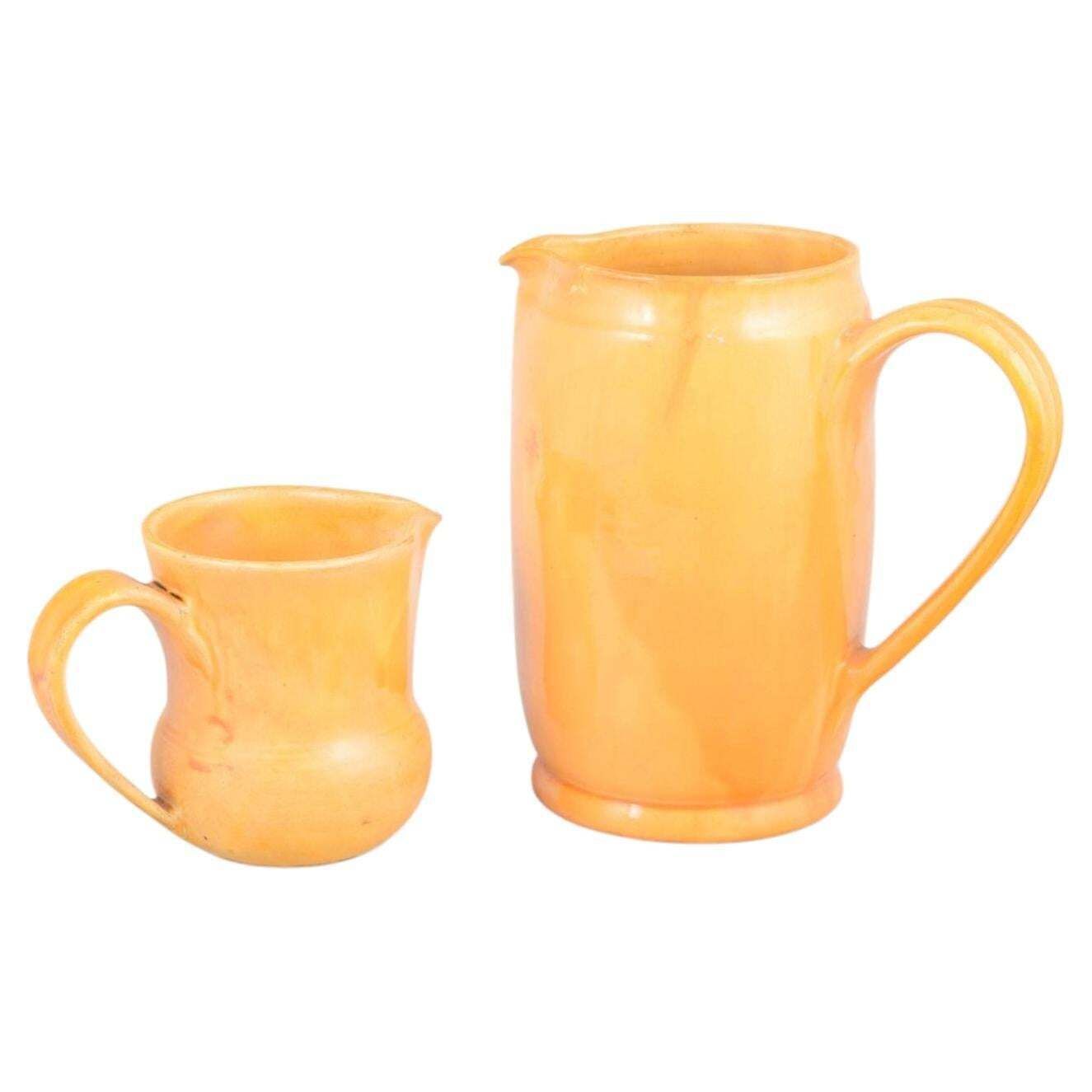 Kähler, Denmark. Twee grote keramische kannen. Geel-oranje glazuur. Jaren 1930
