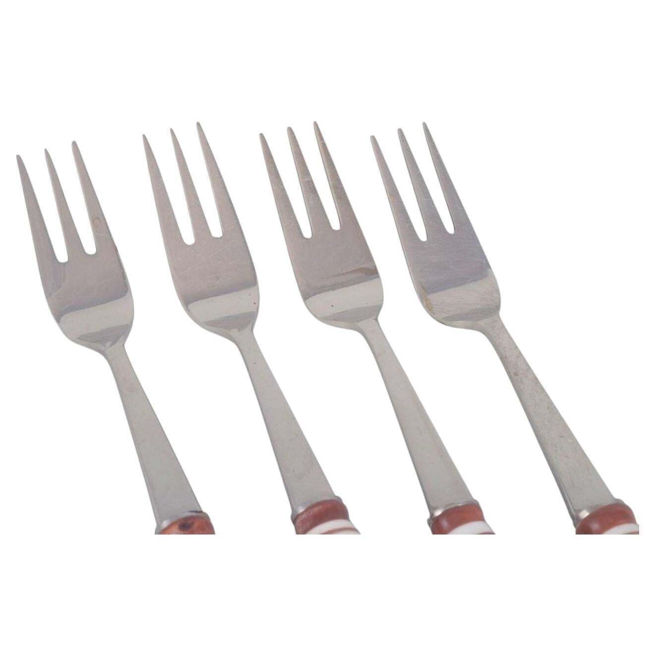 Bjørn Wiinblad For Rosenthal. Four Cake Forks In Stainless Steel And Porcelain. photo furniture