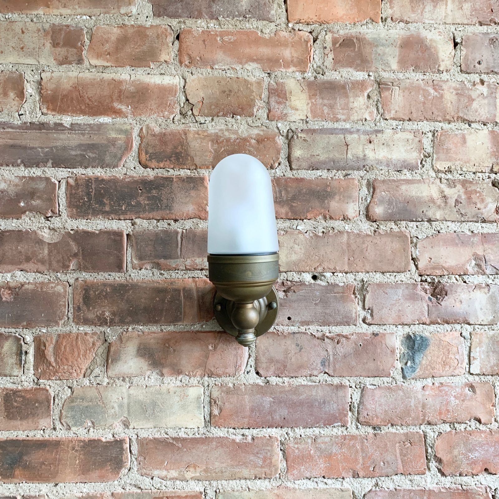 Contemporary Aged Brass Torch Wall Light With Frosted Shade