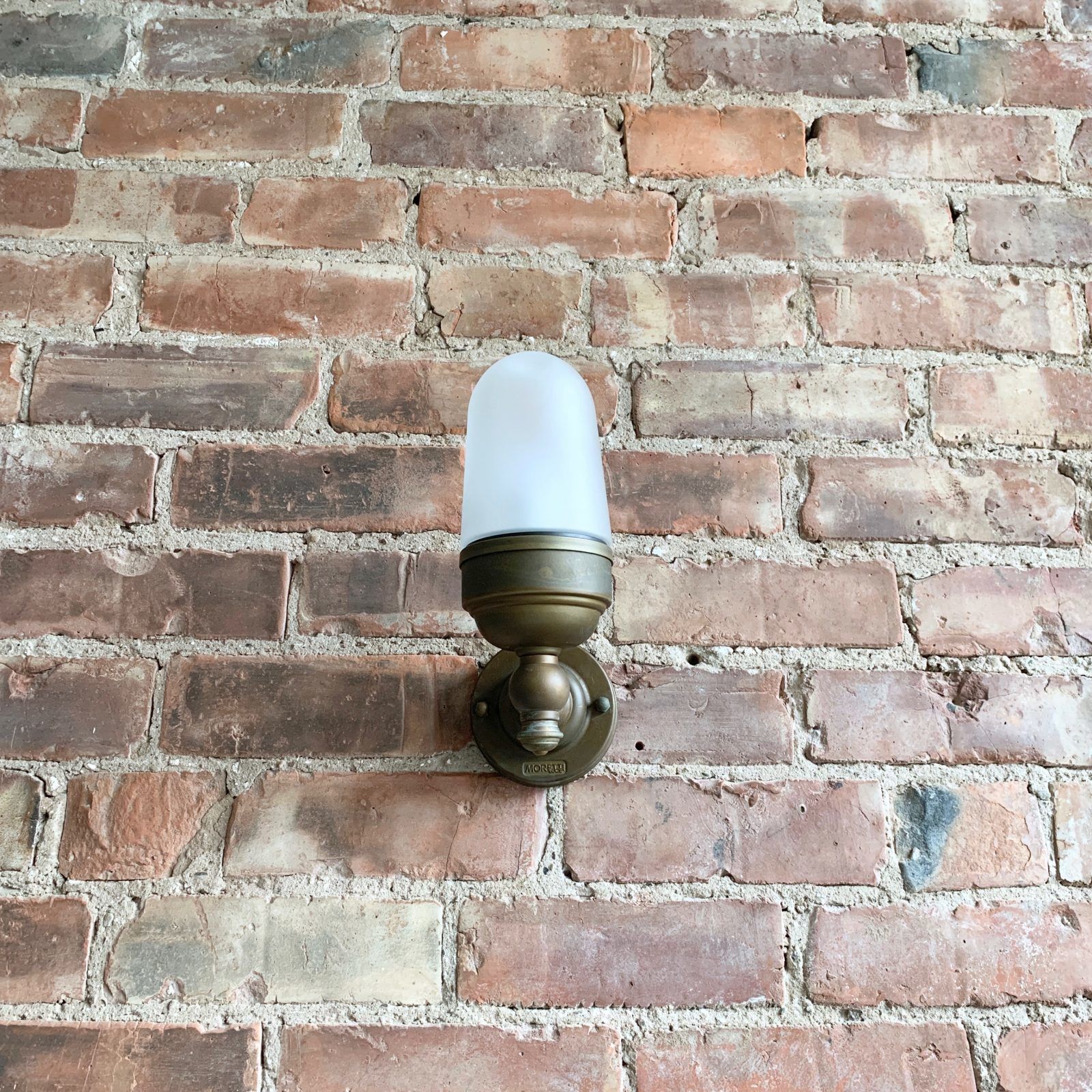 Contemporary Aged Brass Torch Wall Light With Frosted Shade photo furniture