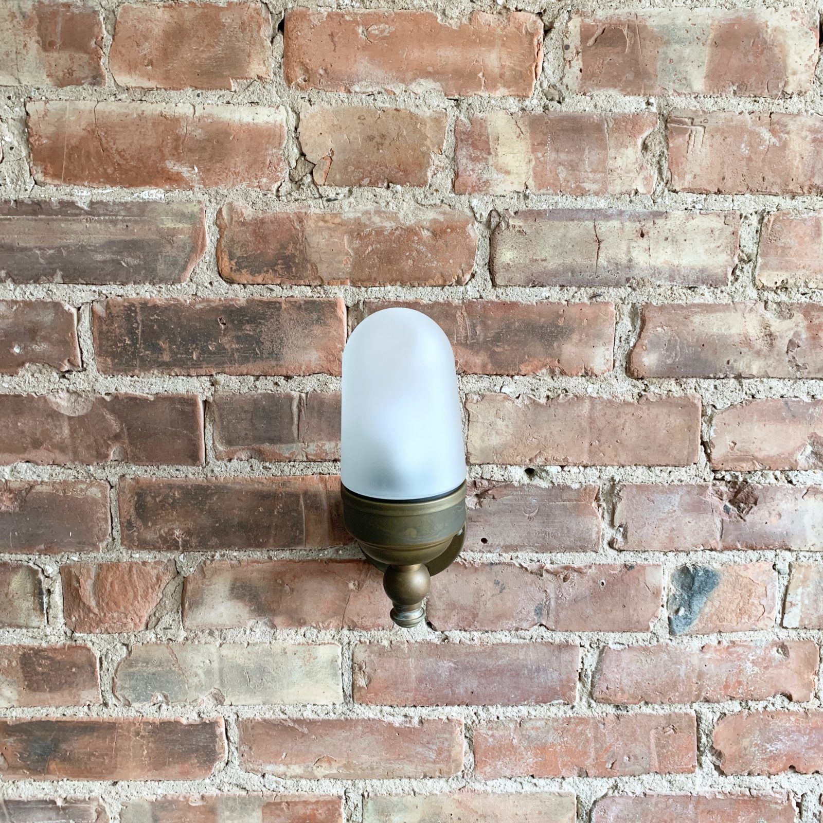 Contemporary Aged Brass Torch Wall Light With Frosted Shade photo for sale
