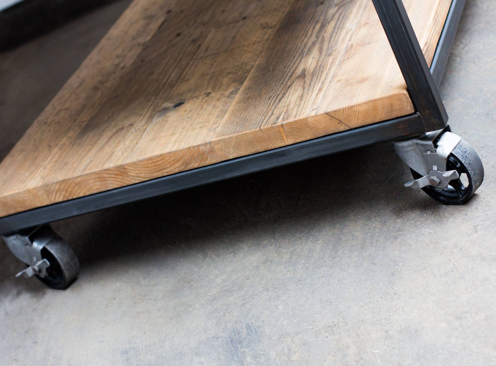 photo furniture Charlie Bespoke Reclaimed Scaffolding Boards And Welded Dark Steel Box Section Framed Table With Shelves And Braked Vintage Castors