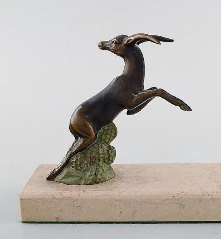 Art Deco Sculpture Of Jumping Bucks In Patinated Metal On Marble Base, 1930s photo for sale
