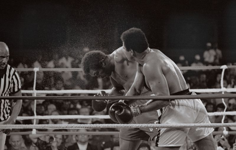 'Muhammad Ali Smashes George Foreman' 1974 Archival Pigment Print Framed In White photo furniture