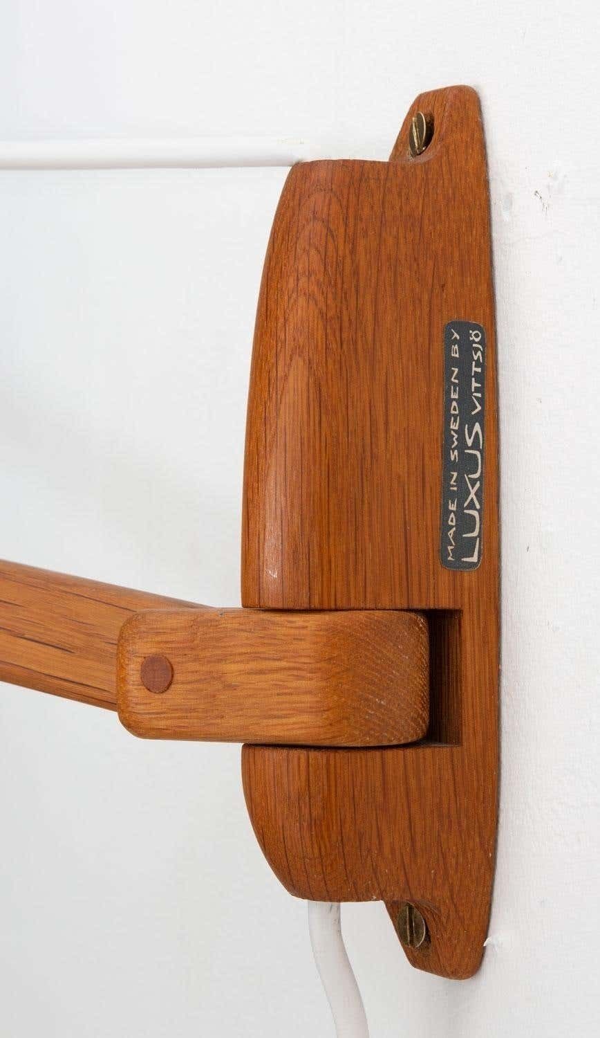 photo for sale Swedish Midcentury Swiveling Wall Lamp In Acrylic And Teak By Luxus