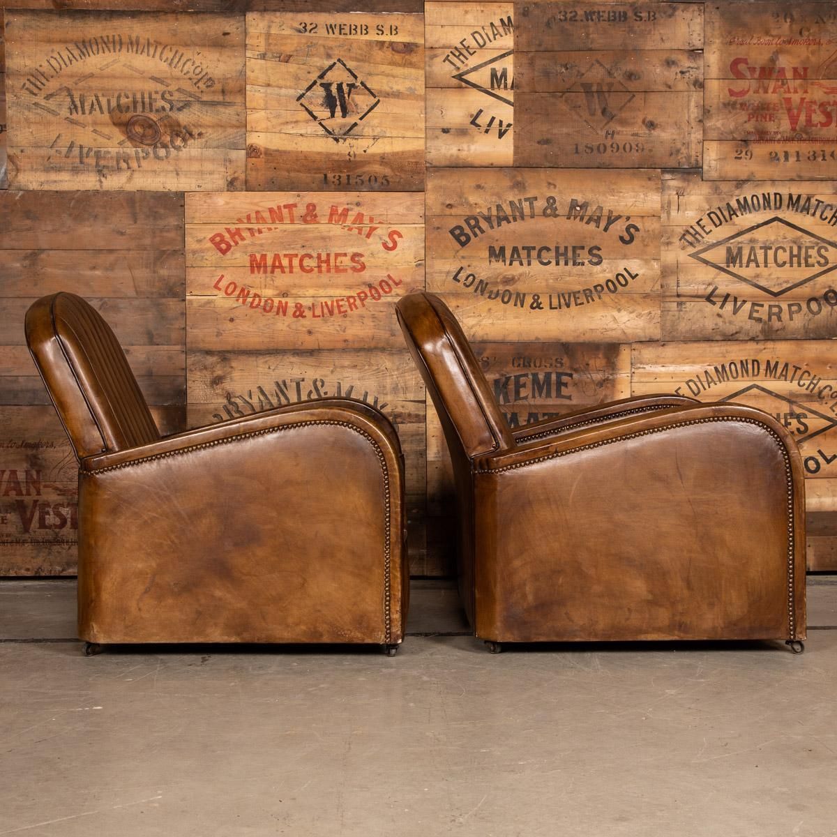 photo furniture 20th Century Art Deco Pair Of Leather Tub Chairs And Sofa, Circa 1920