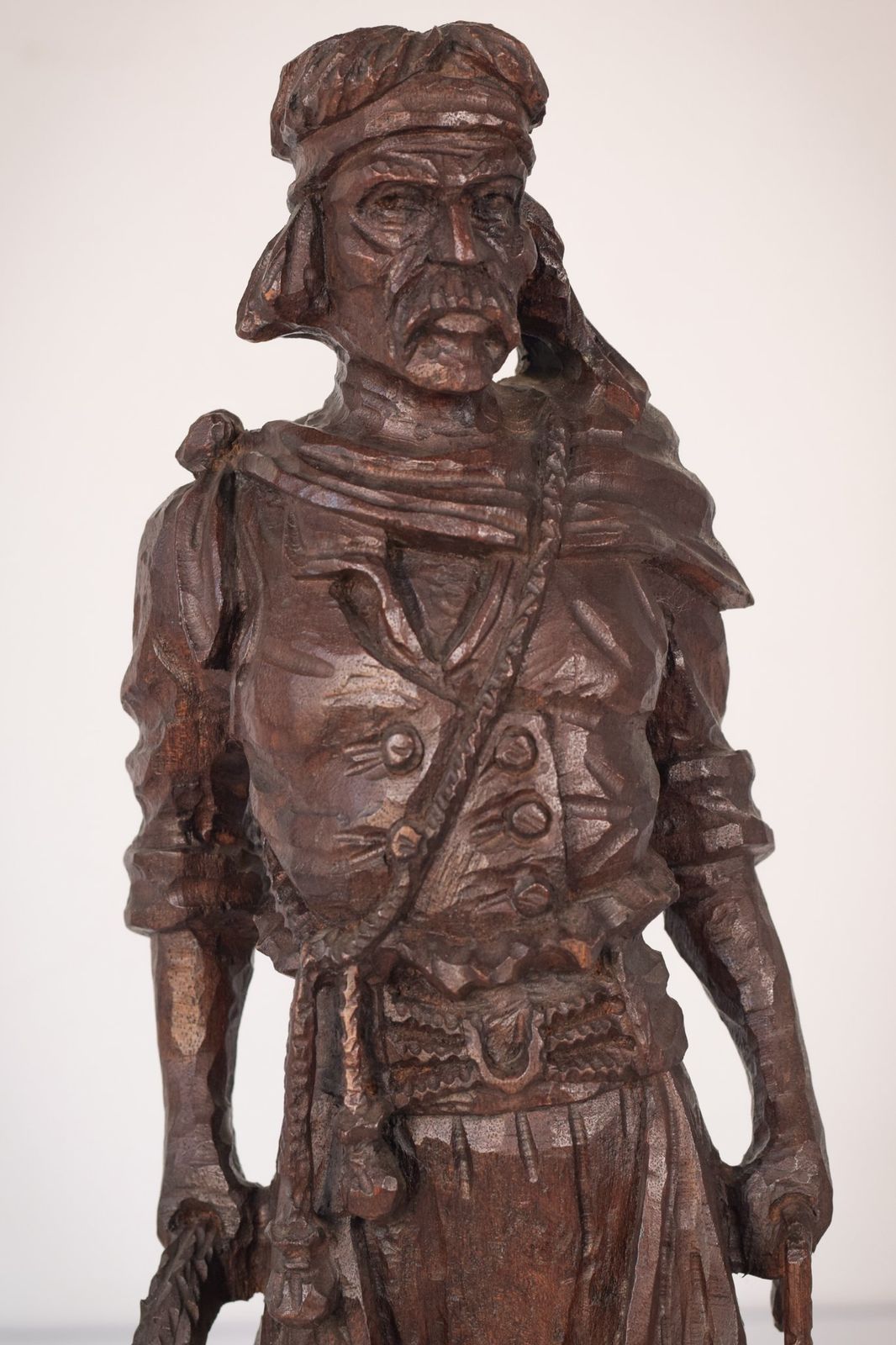 Hand Carved Wooden Sculpture Of A Male Figure photo Art