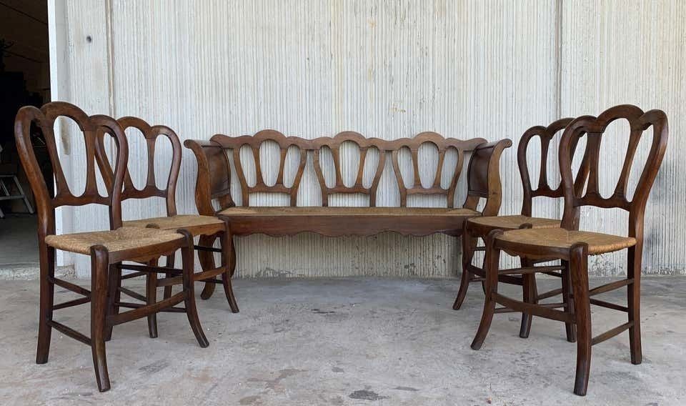 Ensemble de cinq pièces : un banc et quatre chaises victoriennes, bois et rotin, XXe siècle photo for sale