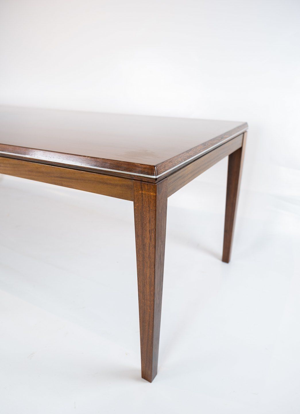 Coffee Table Made In Rosewood Decorated With Metal Edge Of Danish Design From The 1960s. photo for sale